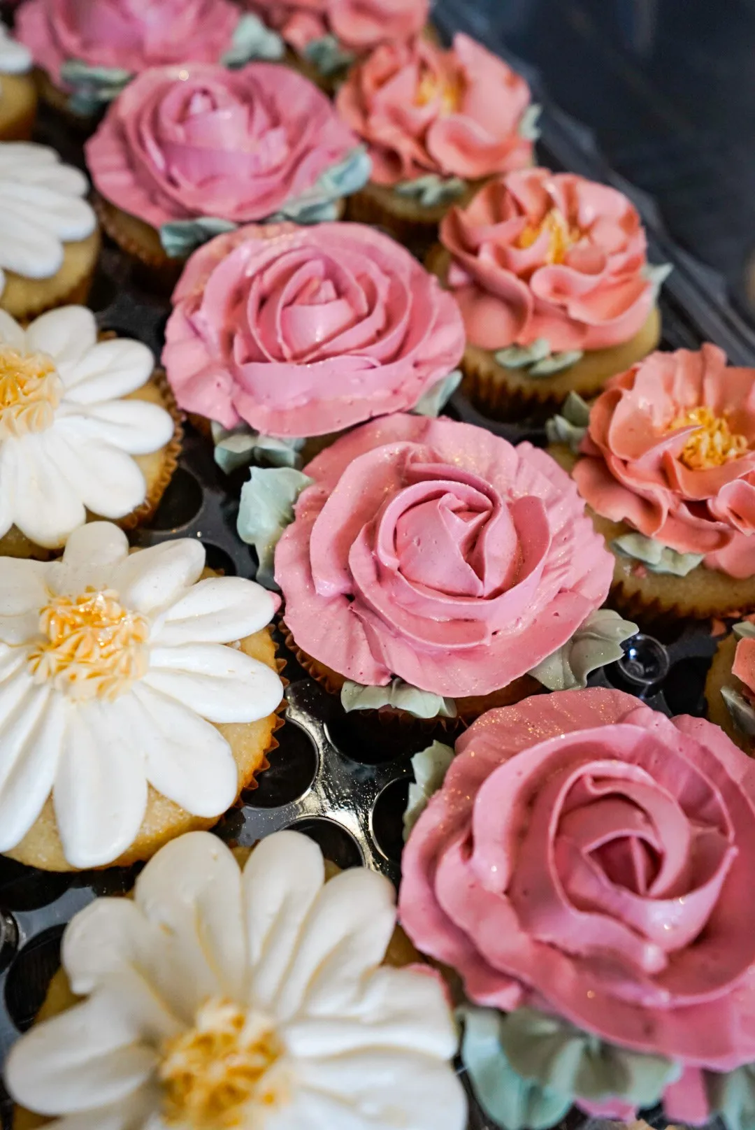 Buttercream rose and daisy cupcakes