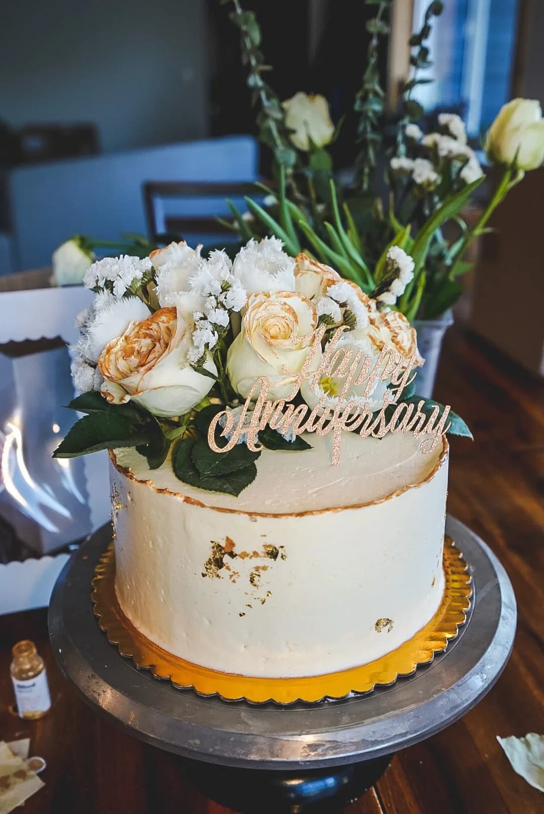 Cream buttercream anniversary cake with cream roses