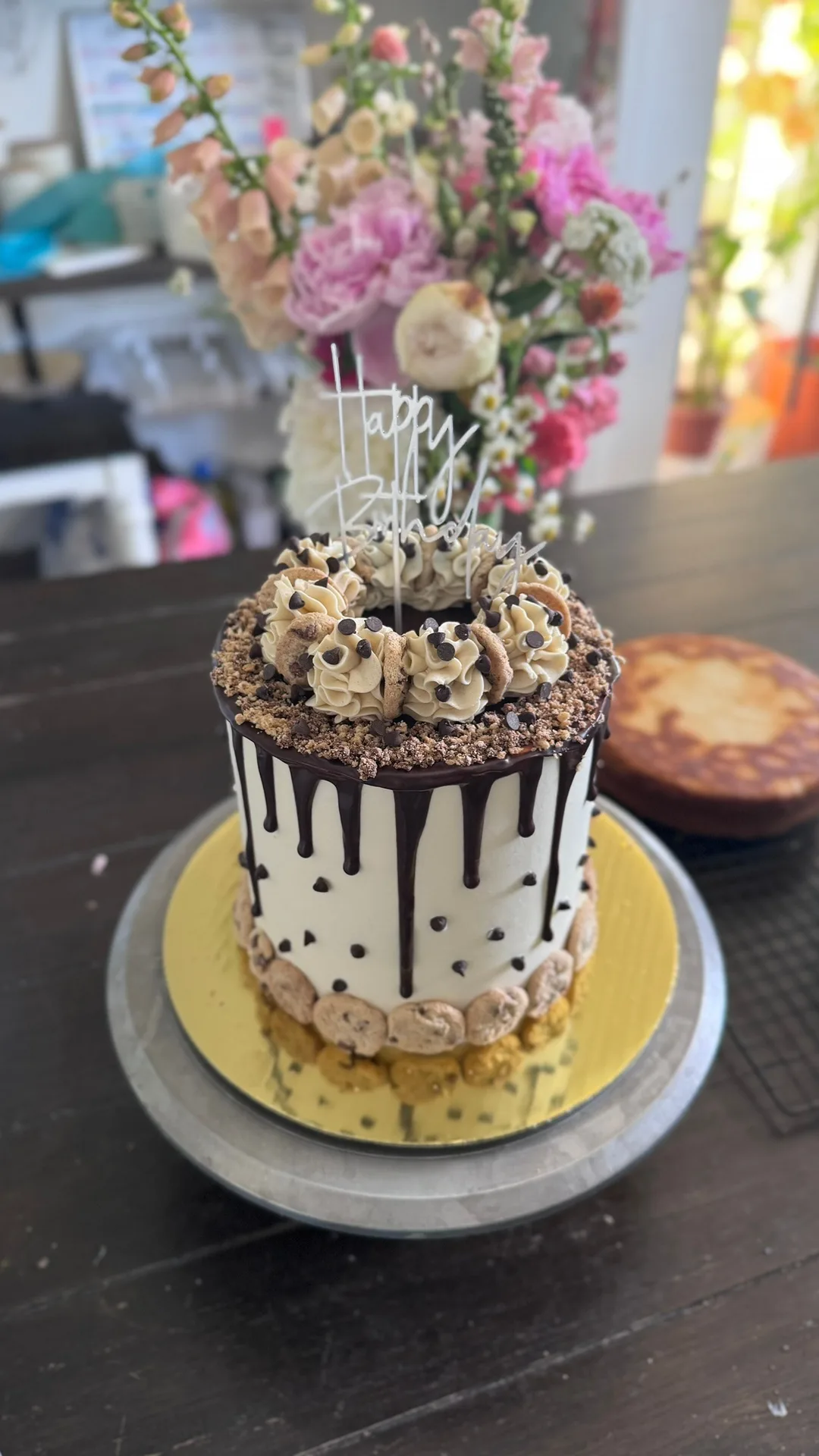 Chocolate drip cake with cookie dough and chocolate chips