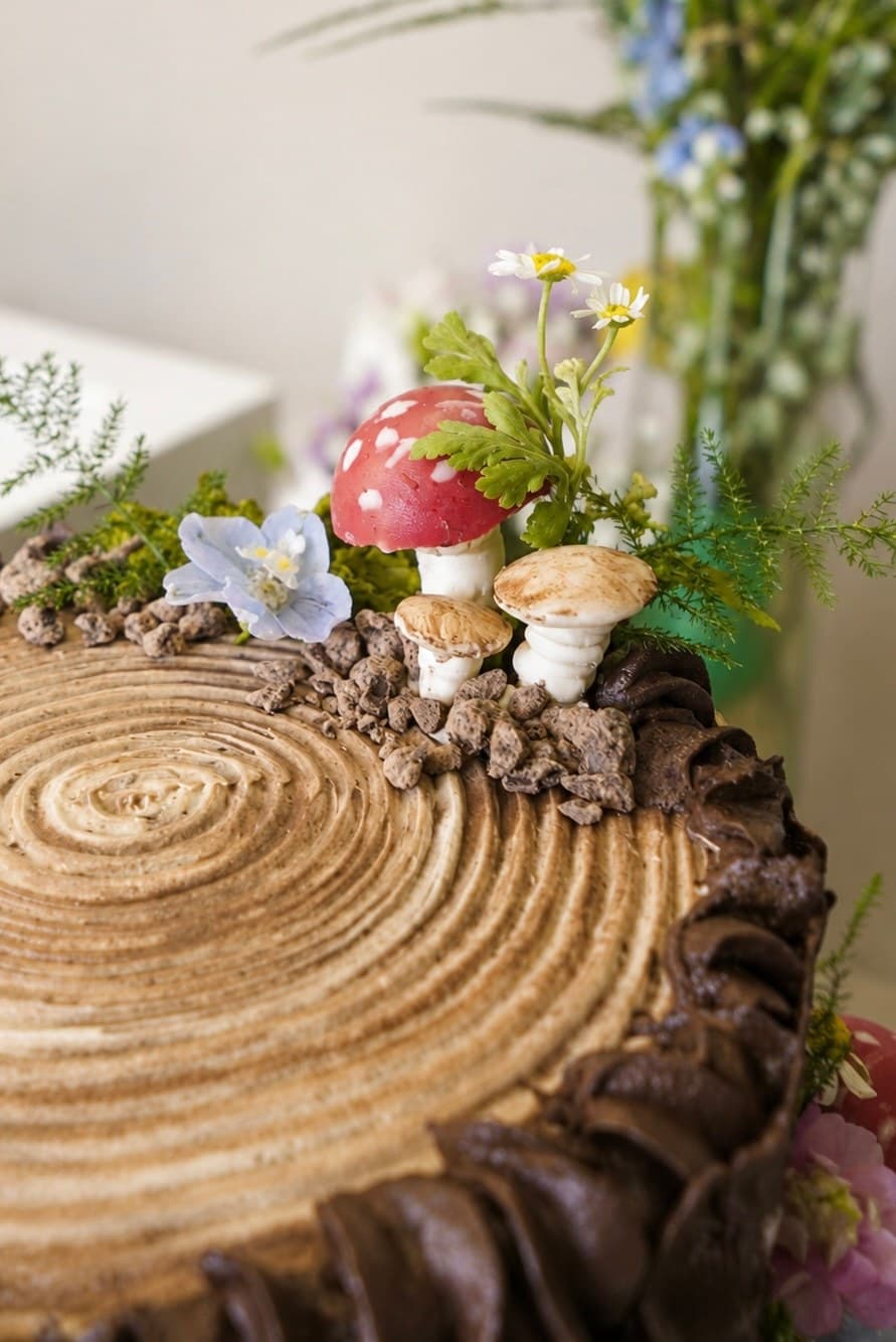 Chocolate buttercream woodland log cake with meringue mushrooms