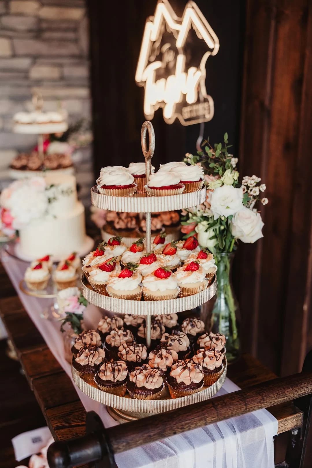 Tiered wedding cupcake tower with strawberry and chocolate cupcakes