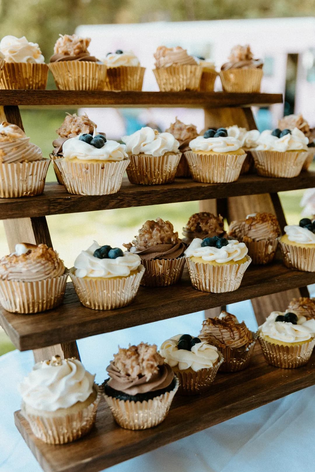 Cupcake display with blueberry and caramel cupcakes