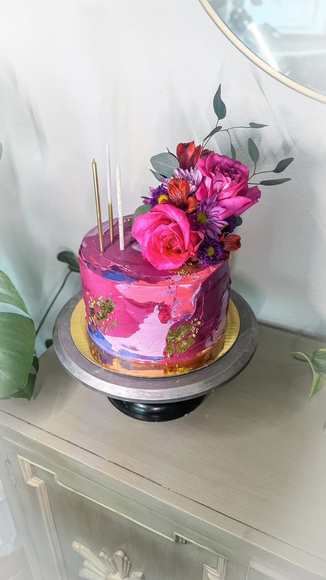 Hot pink palette-knife buttercream cake with fresh roses