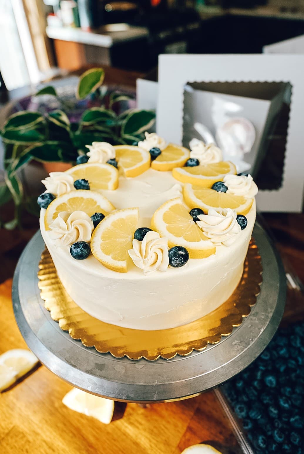 Lemon cake with fresh lemon slices and blueberries