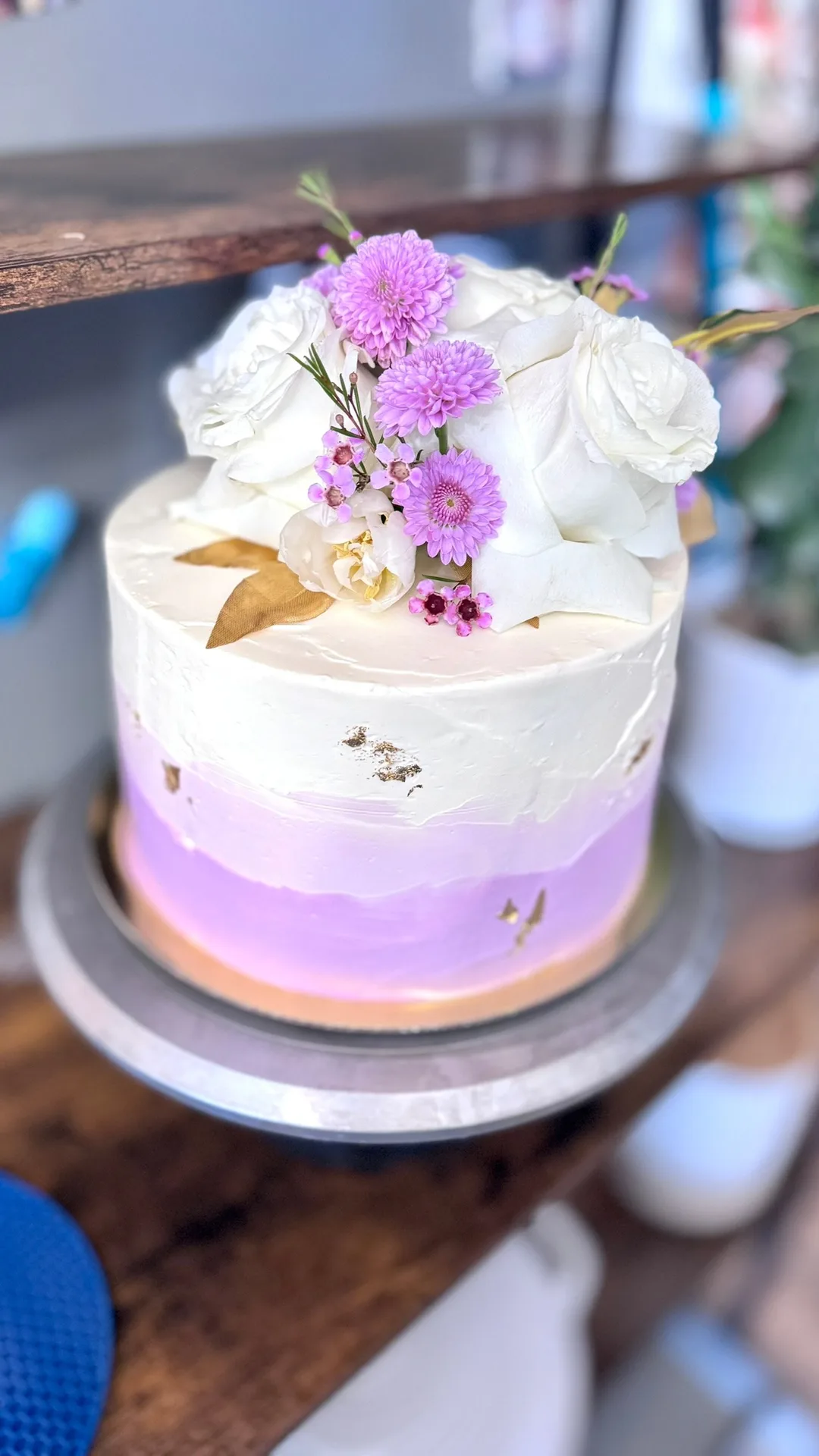 Purple ombre buttercream cake with fresh flowers