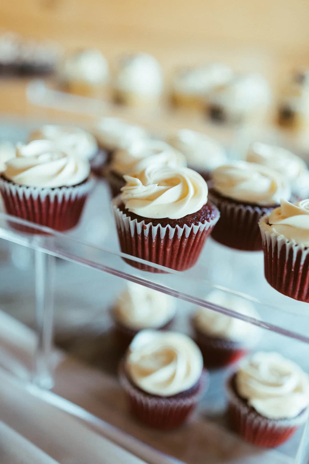 Red velvet cupcakes on an acrylic display