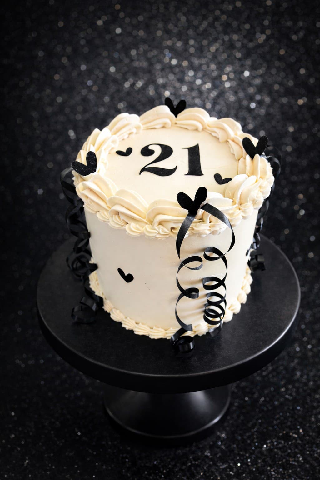 Vintage-piped ivory cake with black 21 lettering